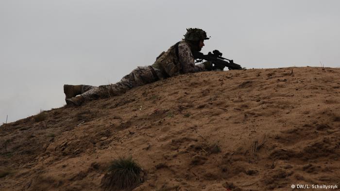 Latvians keep calm but also keep allies, weapons close